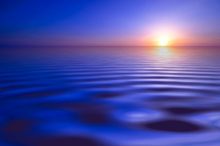 水波涟漪与天边的夕阳摄影高清图片