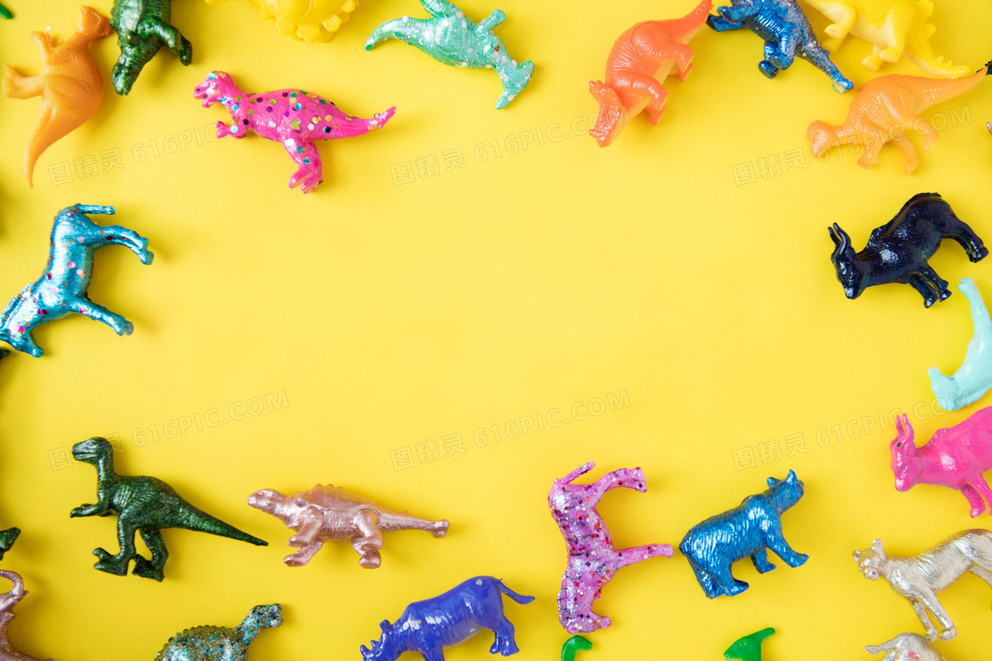 玩具恐龙黄色背景图片