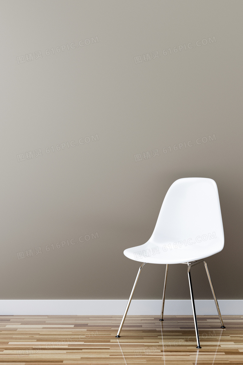 一只靠墙放的白色椅子摄影高清图片