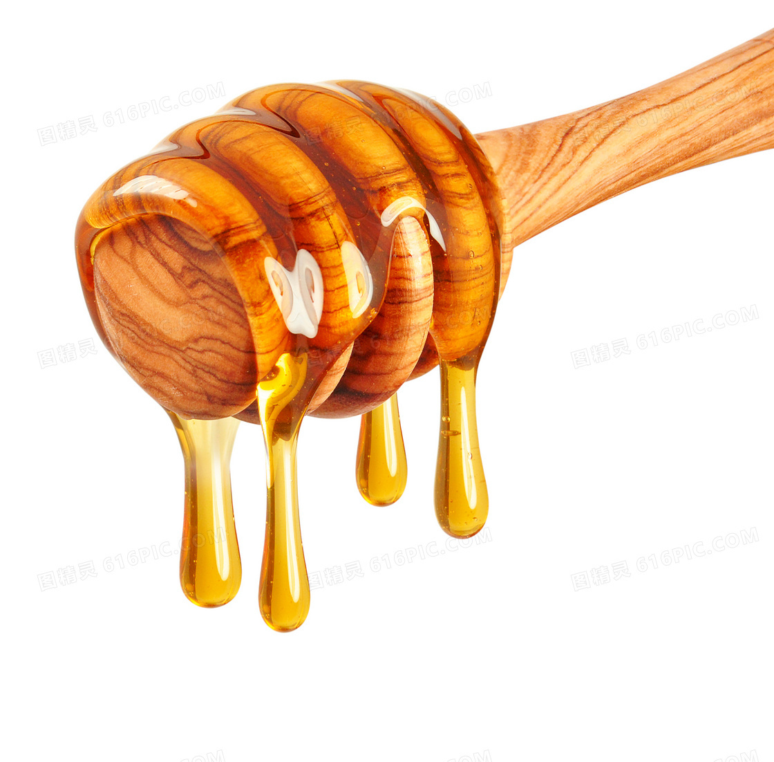 在木制搅拌棒上的蜂蜜特写高清图片