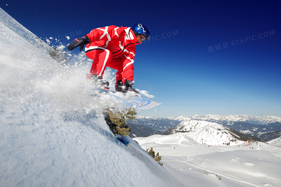 从山腰上滑下来的滑雪人物高清图片