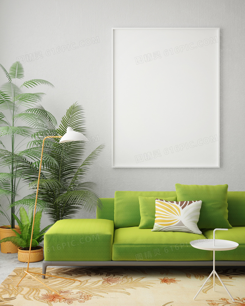 房间绿色沙发与空白装饰画高清图片