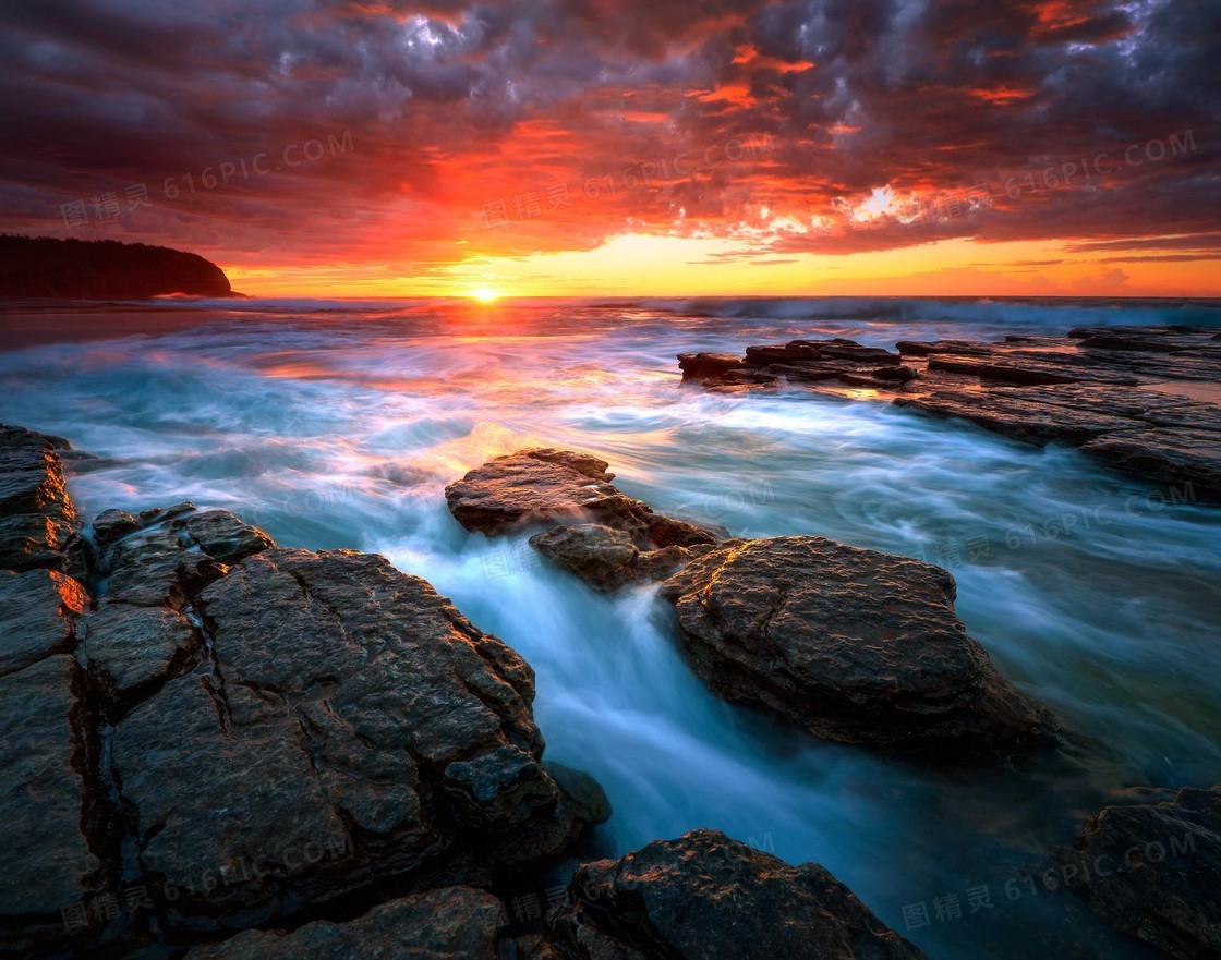 海边礁石夕阳美景高清摄影图片