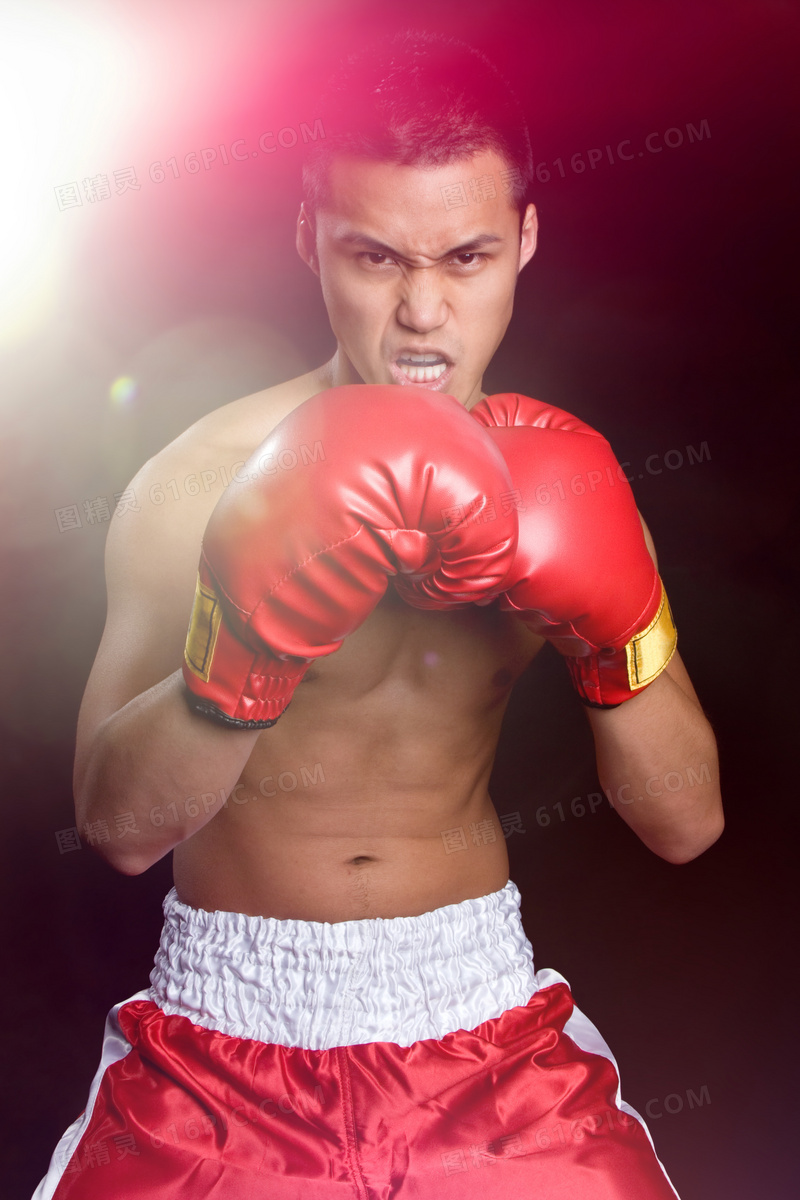 戴着红手套的拳击男子摄影高清图片