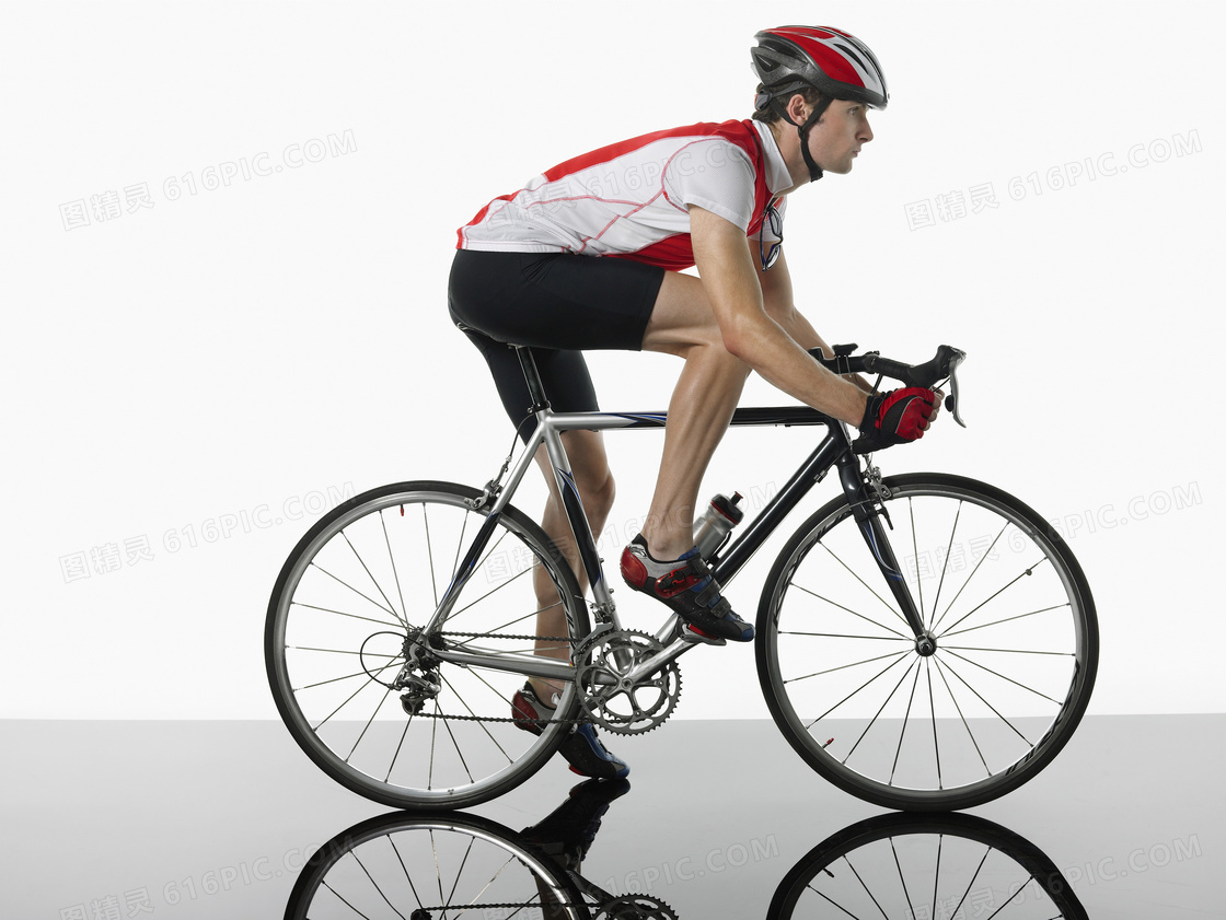 骑着自行车的车手人物侧面摄影图片