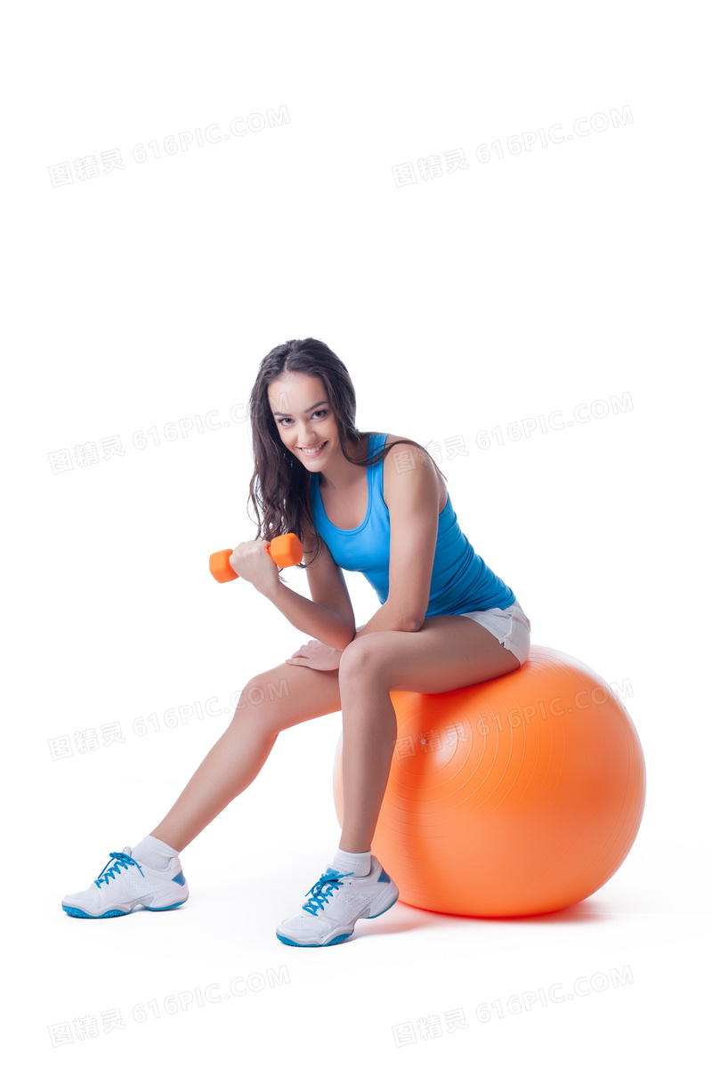 在橙色健身球上的美女摄影高清图片