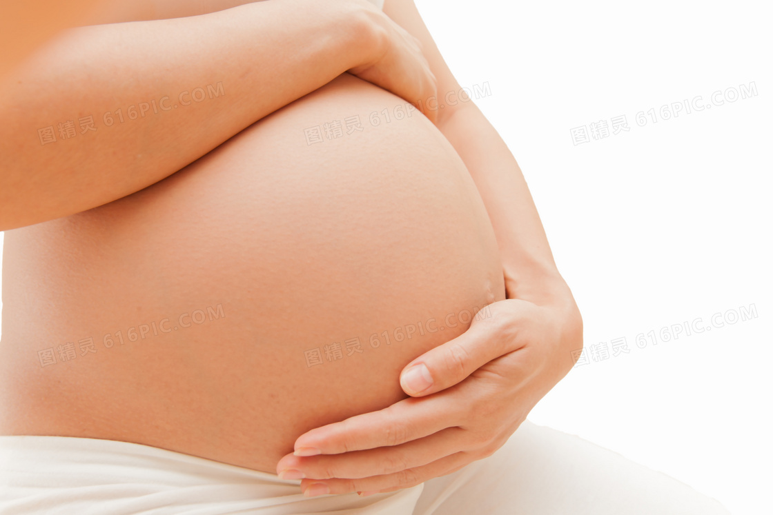 抚摸大肚子的孕妇局部摄影高清图片
