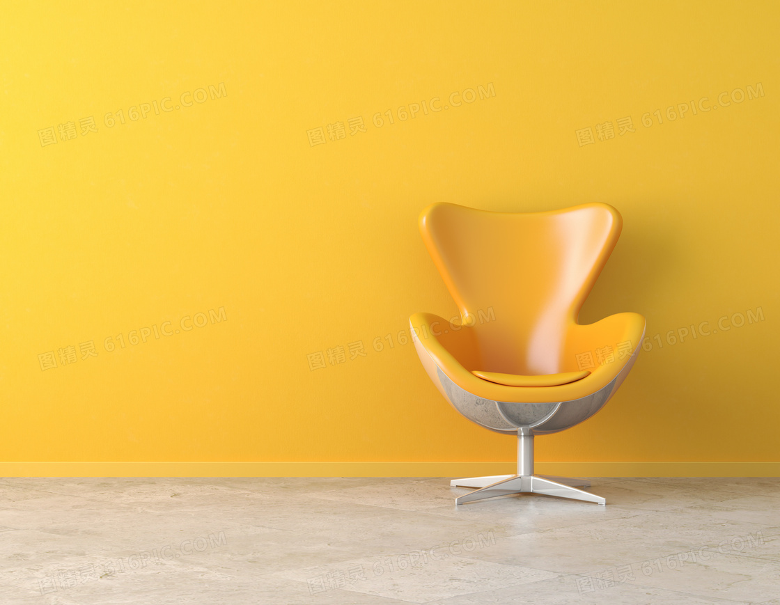 靠墙壁放着的黄色椅子摄影高清图片